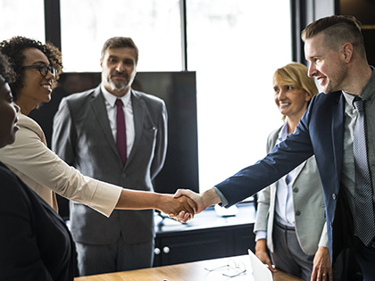 Business people shaking hands in a meeting room